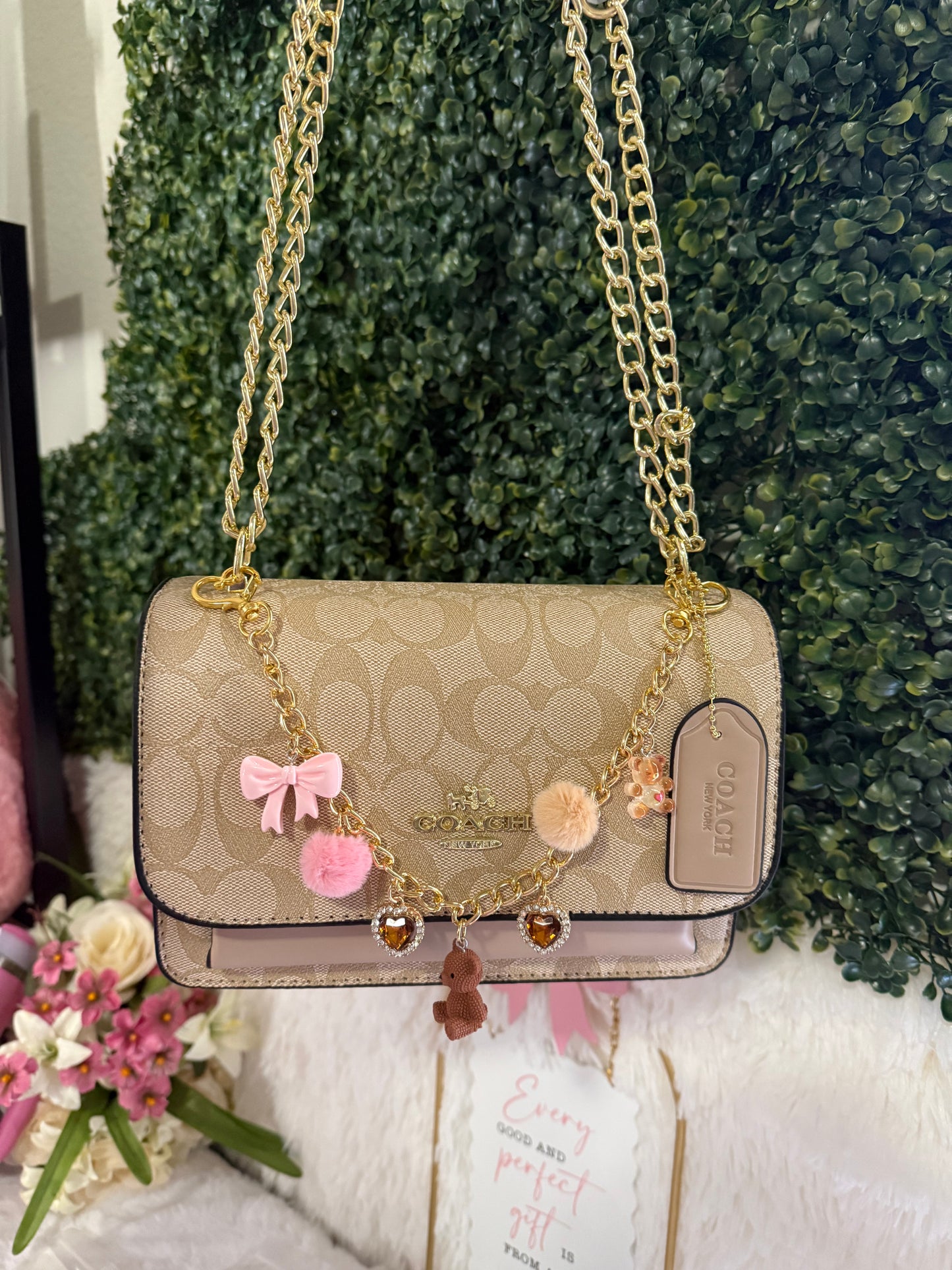 Beige coach with charm