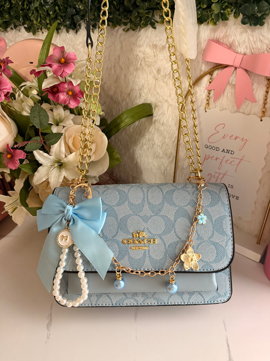 Coach blue Whit charms