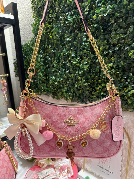 Pink coach and charms pink