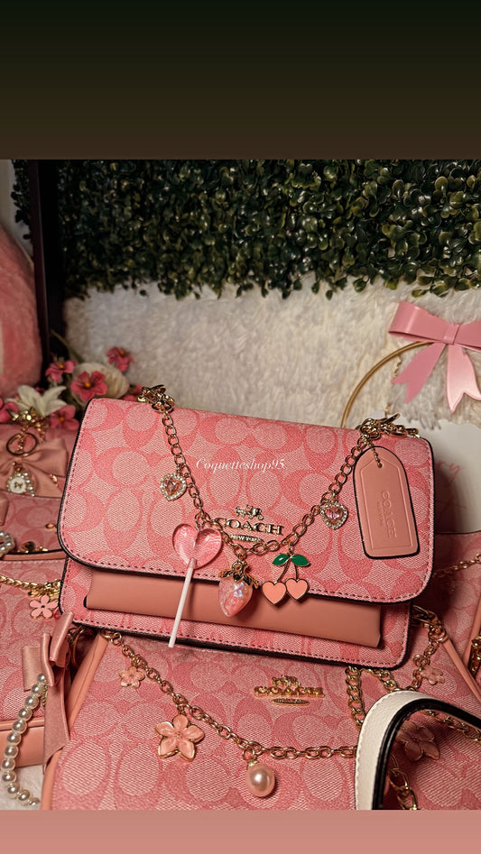 Purse pink coach with charms